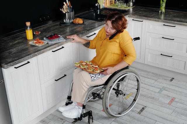 a%20person%20in%20a%20wheelchair%20talking%20on%20the%20phone%20in%20their%20kitchen a%20person%20in%20a%20wheelchair%20talking%20on%20the%20phone%20in%20their%20kitchen